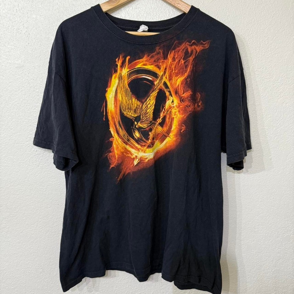 Black graphic tee with‎ The Hunger Games Mockingjay design
